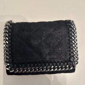 STELLA MCCARTNEY Black Small Falabella Wallet Faux-suede wallet in black.